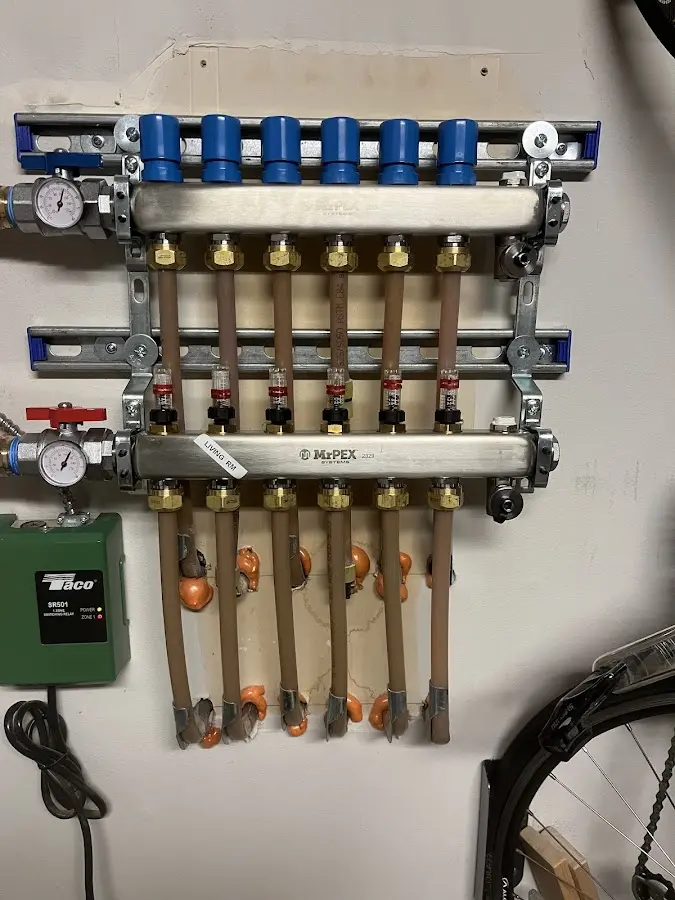 Plumber performing Water Heater Repair at a residential property in St. Johnsbury